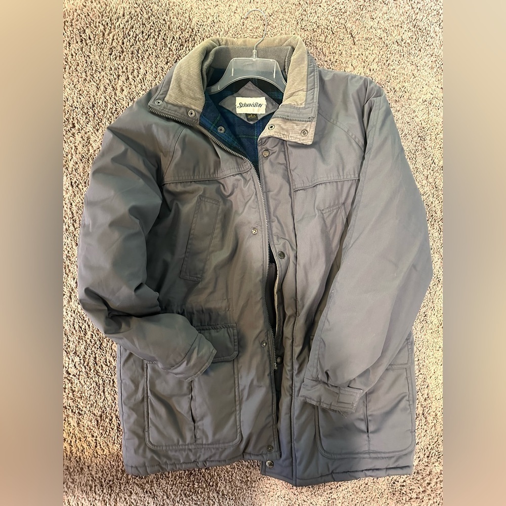 Brand: St. John’s Bay
Grey and blue plaid lining jacket with a relaxed fit.